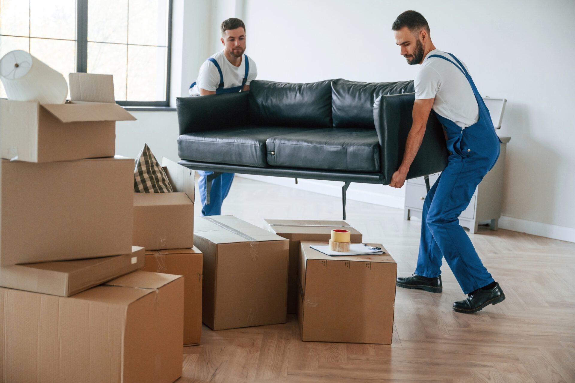 two moving service employees in a room 1